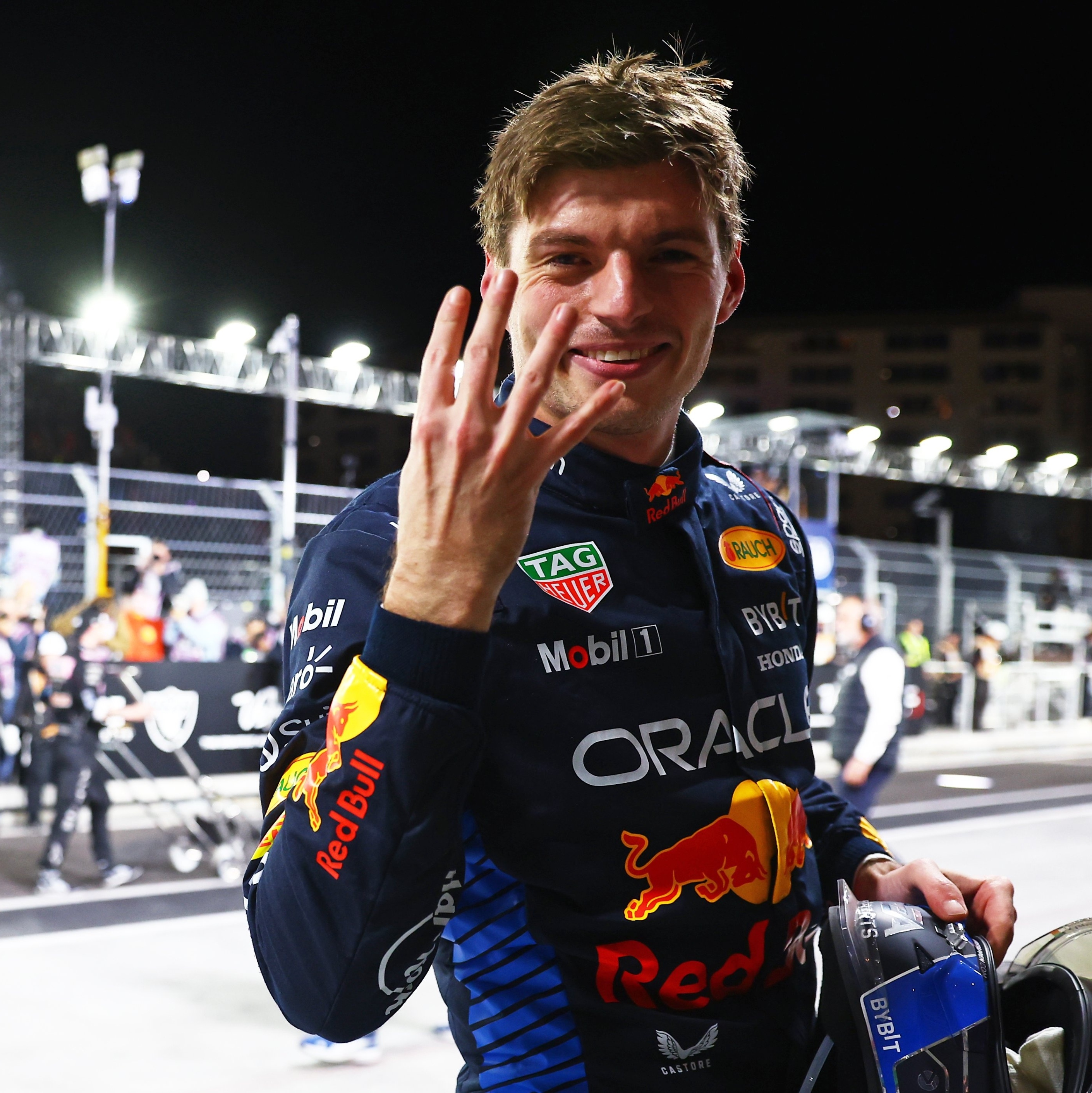 Max Verstappen celebrating his fourth Formula 1 world championship with four fingers raised